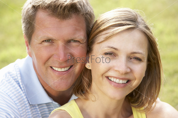 Close up of middle aged couple outdoors