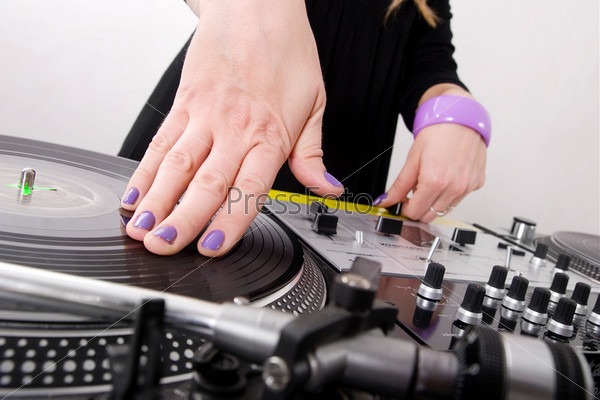 Hands of female hip-hop DJ scratching