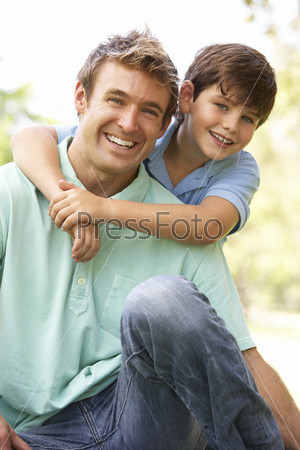 Portrait Of Father And Son In Park
