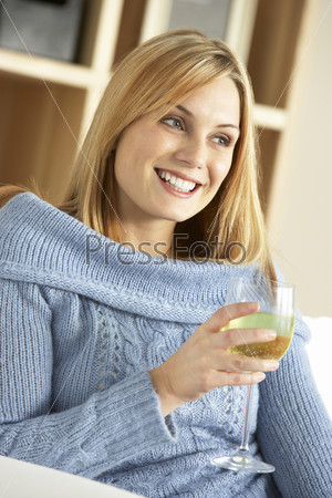 Young Woman Enjoying Glass Of Wine
