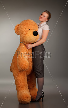 beautiful girl with funny toy bear