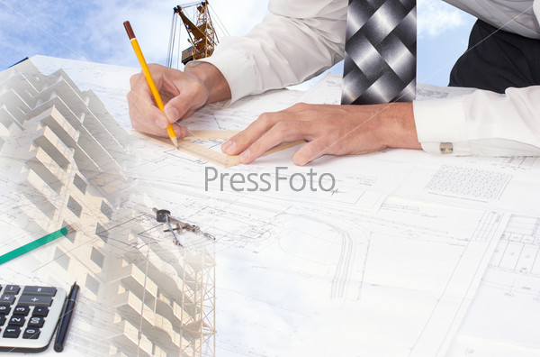 The engineer-the designer develops a construction plan of a many-storeyed apartment house