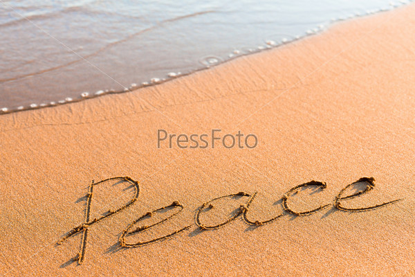 Word Peace on sand