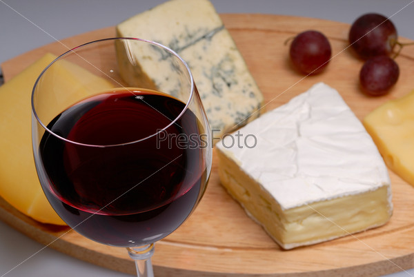Glass of wine and cheese, stock photo