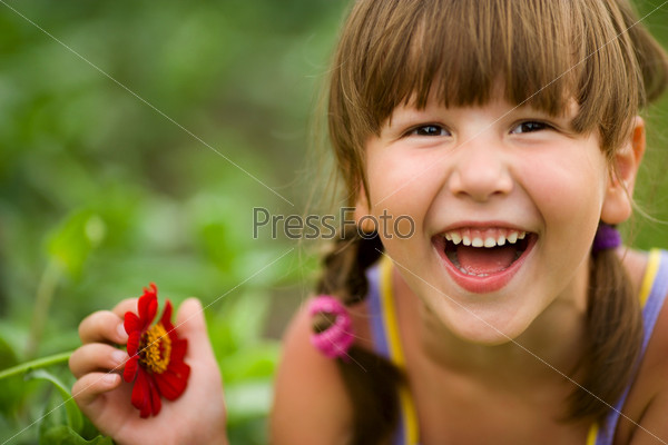 Happy five years Girl laughing outdoors headshot
