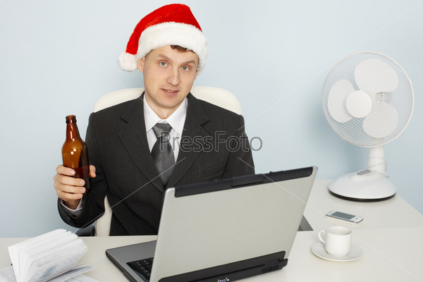 Businessman meets the new year still working in office