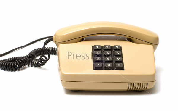 Old Beige key telephone system on a white background.