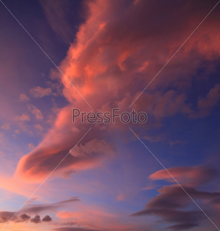 big red cloud in the form of leg at sunset