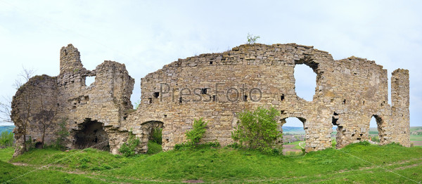 Spring view of Chernokozinetsky castle  ruins (Chernokozintsy village , Kamyanets-Podilsky region, Khmelnytsky Oblast, Ukraine). Built in second half of XIV th century. Two shots stitch image.