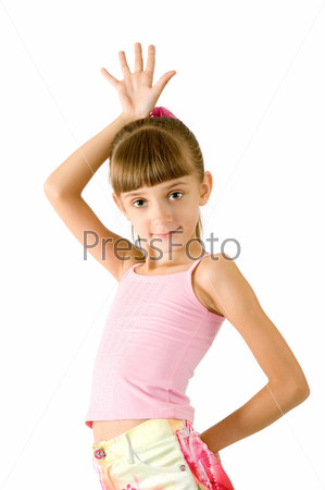 The girl in a pink blouse is photographed on the white background