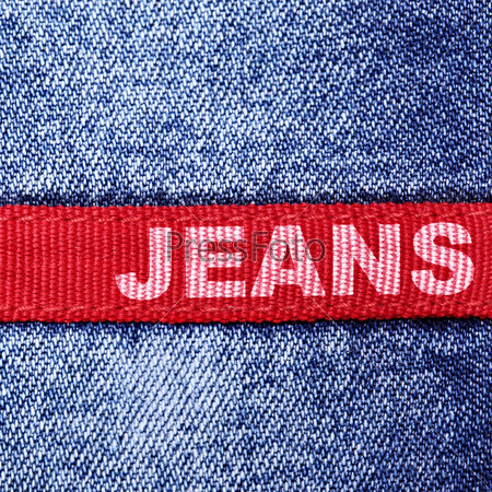 Blue jeans and red label with word \