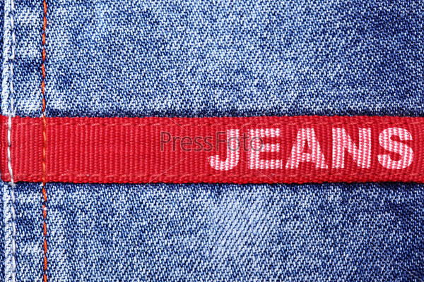 Blue jeans and red label with word \