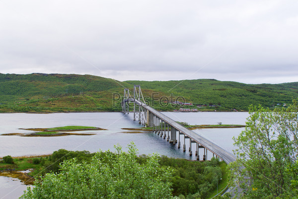 The bridge through the river on the Norwegian road, stock photo
