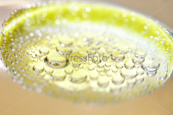 Lemon and drops of carbonated water, stock photo