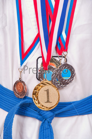 Teenage Boy Wearing Winning Medal