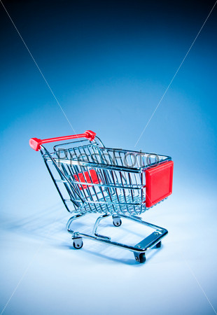Empty shopping cart on the blue