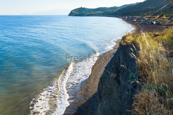Beautiful evening summer coastline and camping on beach Crimea, Ukraine, stock photo