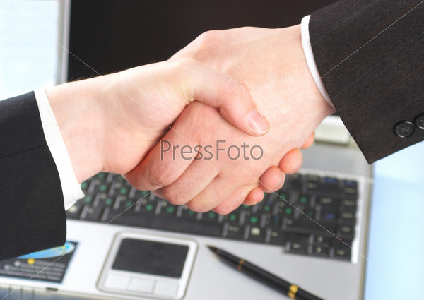 Hand shake of two people. Businessmen, stock photo