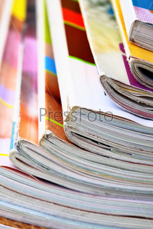 Pile of a colorful magazines close up