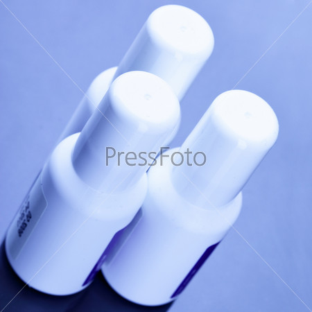 Three spray cans with drugs close up