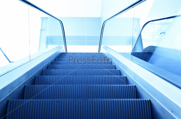 Perspective of escalator toned in blue color