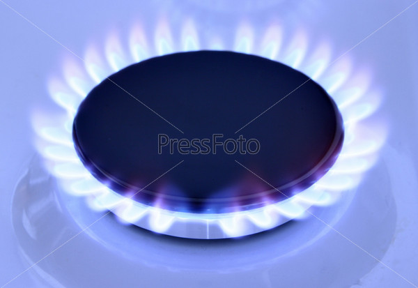 Blue gas flame on hob and space for text on left
