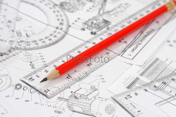 The pencil and ruler lie on the drawing