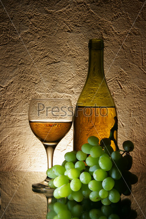 Still-life with bunch of grapes and white wine, stock photo