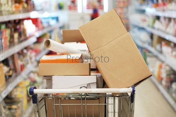 Cart with empty boxes in a supermarket