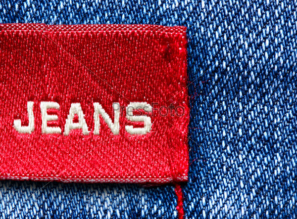 Blue jeans and red label with word Jeans