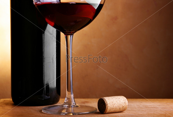 Still-life with wine bottle, cork and glass, stock photo