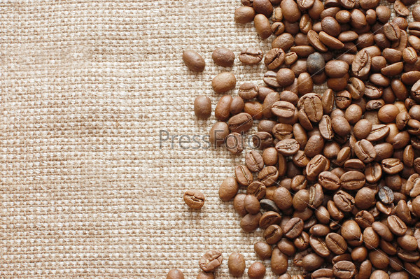 Coffee beans on a burlap texture