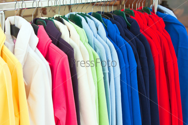 Multicolor sport shirts hanging in store