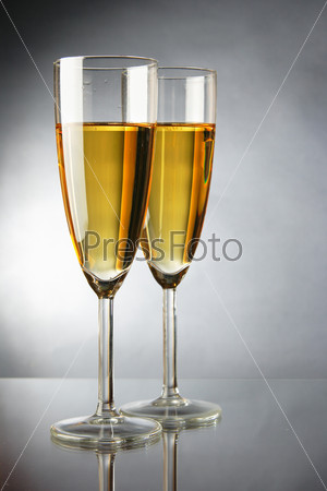 Champagne over grey background
