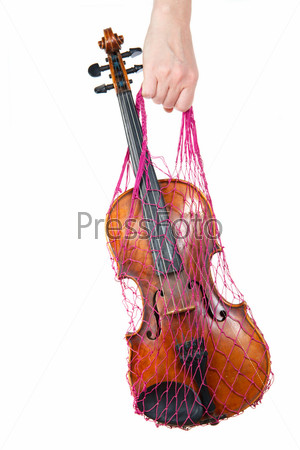 Female hand holding a red mesh with the violin, isolated, on a white background