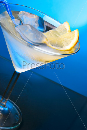 Glass with ice cubes and lemon