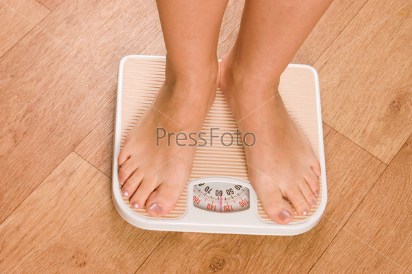Female feet on scales (feet, scale, weight)
