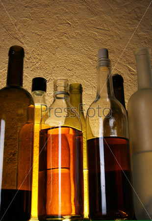Still life with alcoholic drinks over yellow background