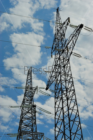 High voltage powerline over blue sky