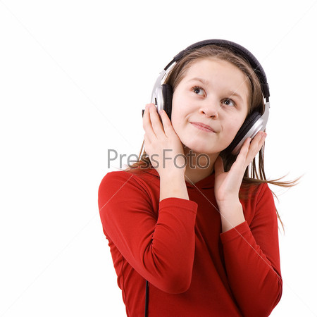 On white background the girl in the big ear-phones listens to music and smiles