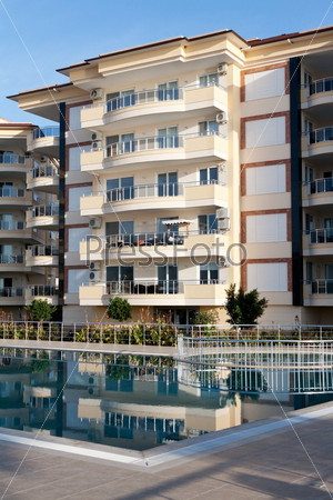 Beautiful house with balconies and a pool, stock photo
