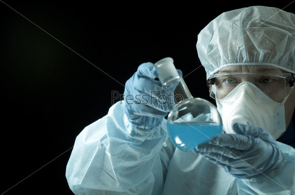 Scientist working in laboratory, black background