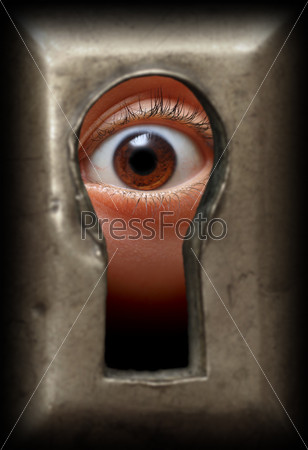 curiosity eye in keyhole - spy concept