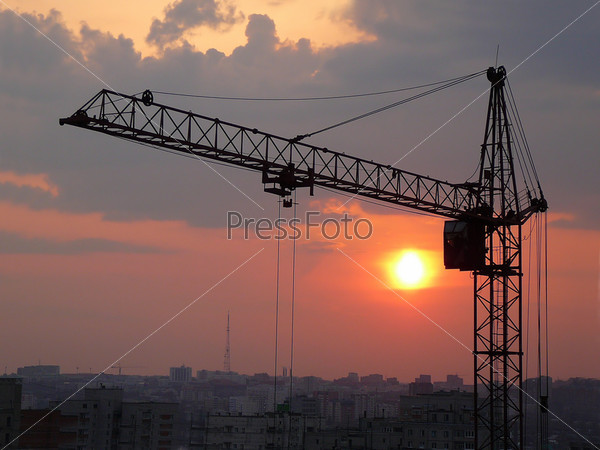 lifting crane with evening sunset background