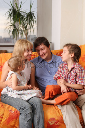 Happy family of the house on a sofa 6