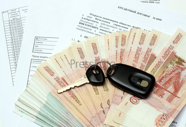 Car keys and money on credit contract