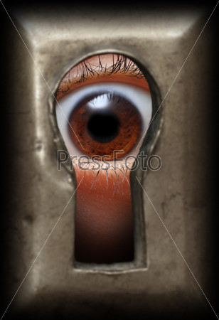 curiosity eye in keyhole - spy concept