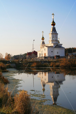 The photo of the classical russian church in the small village