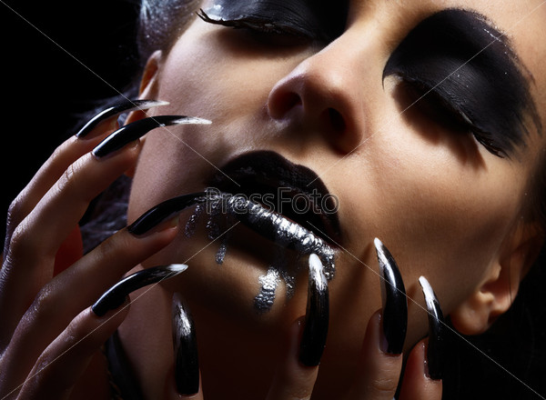 gothic lips zone make-up and long nails manicure