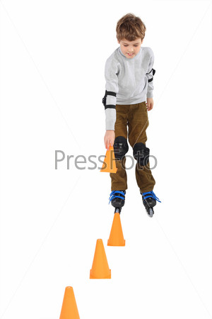 little boy with cone in hand rollerblading near orange cones looking down isolated on white